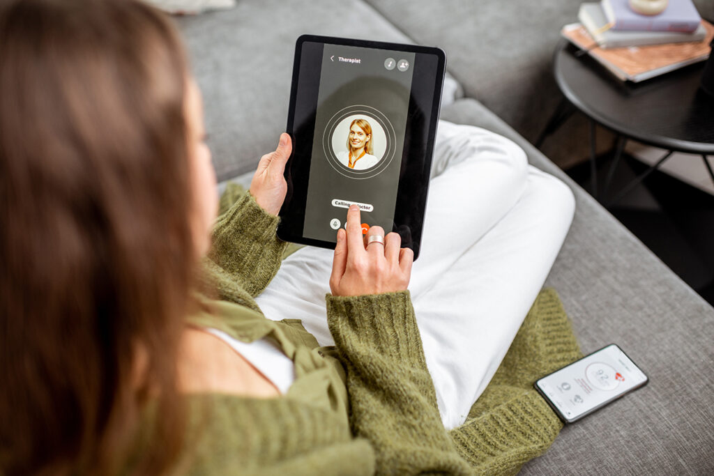 woman looking at tablet